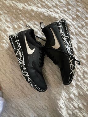 Nike Black Sneakers with White Swoosh and Geometric Sole